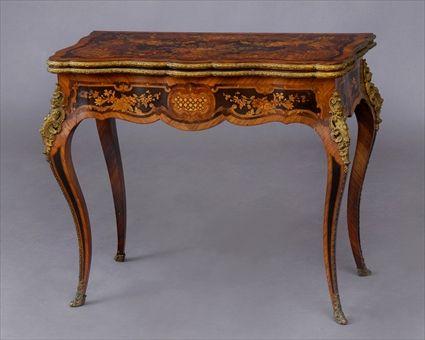 Appraisal: LOUIS XV-STYLE GILT-METAL-MOUNTED MARQUETRY-INLAID GAMES TABLE The scallop-fronted folding top