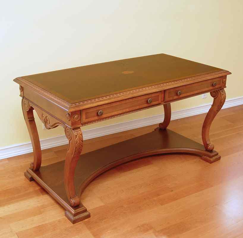 Appraisal: CONTEMPORARY DRAWER LIBRARY TABLE Carved trim scrolled legs resting on