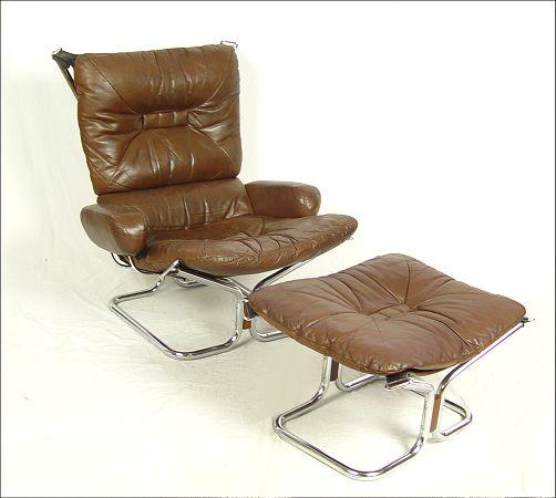 Appraisal: NORWEGIAN FALCON TYPE CHAIR WITH OTTOMAN Brown leather rosewood accents