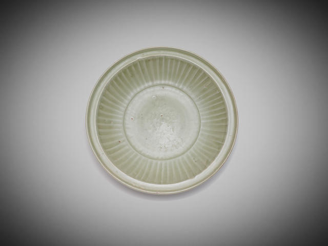 Appraisal: A moulded Chinese Longquan 'aster' celadon-glaze charger Yuan Ming dynasty