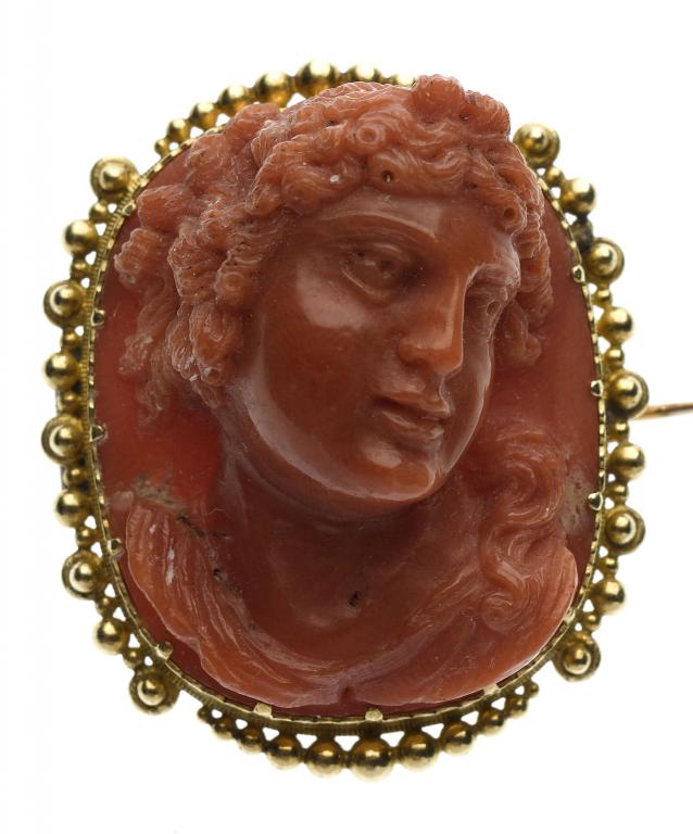 Appraisal: A CORAL CAMEO carved with the head of a bacchante