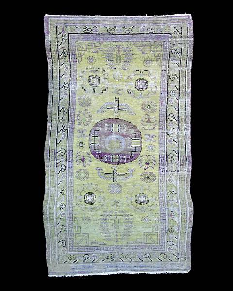 Appraisal: A Khotan rug East Turkestan circa The single aubergine ground