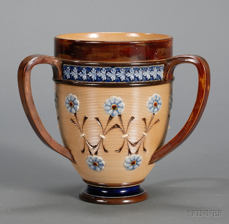 Appraisal: Doulton Lambeth Stoneware Three-handled Cup England early th century wide