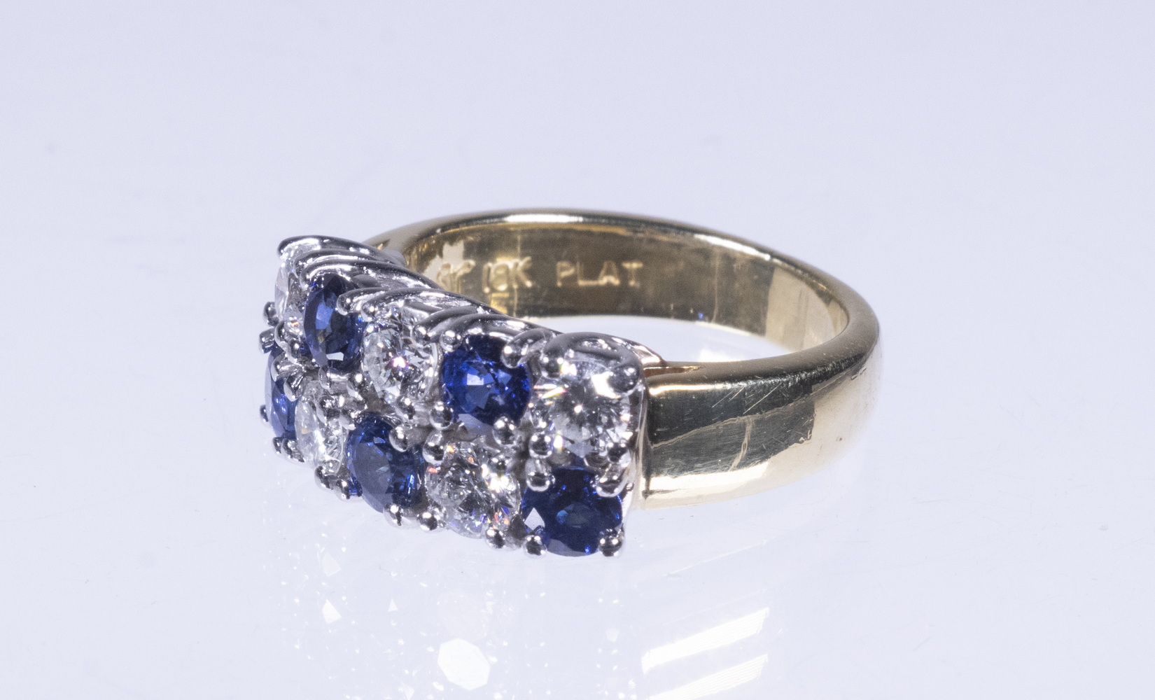 Appraisal: LADIES CONTEMPORARY DIAMOND AND SAPPHIRE RING K gold and platinum