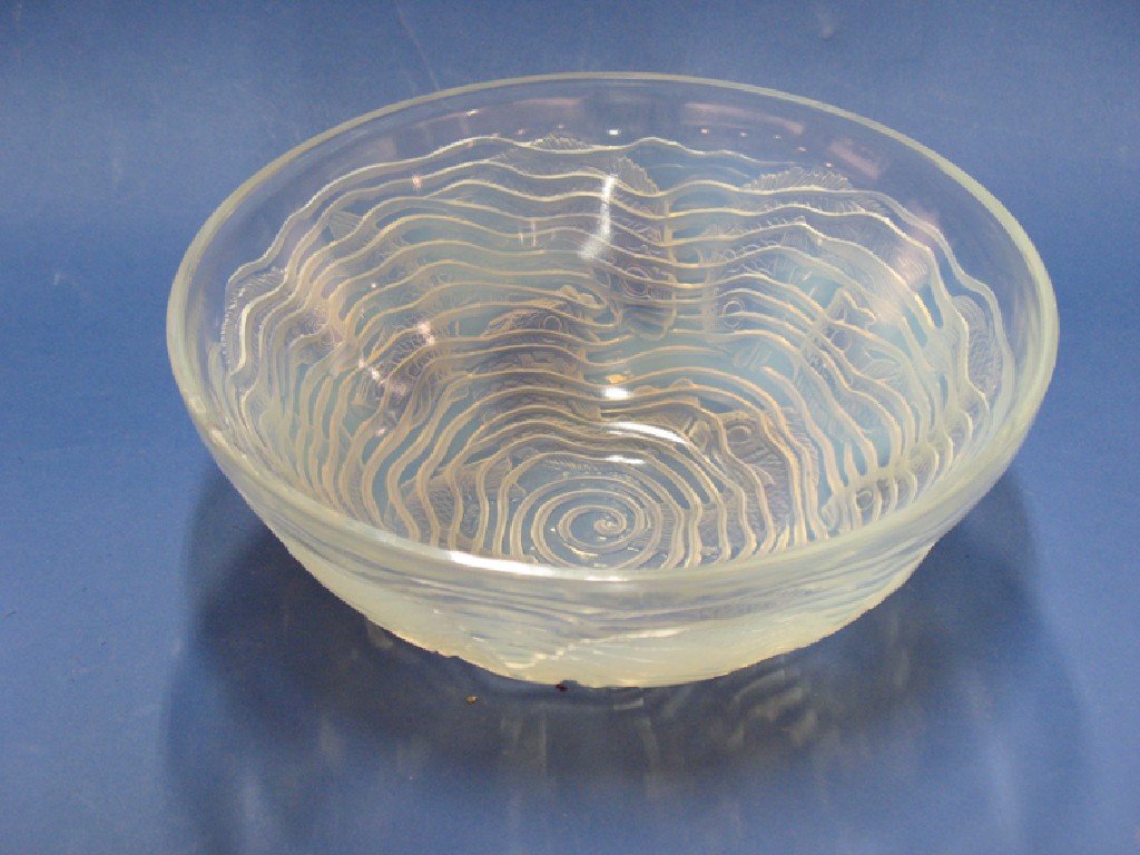 Appraisal: LALIQUE DAUPHINS A MOULDED GLASS BOWL decorated with fish swimming