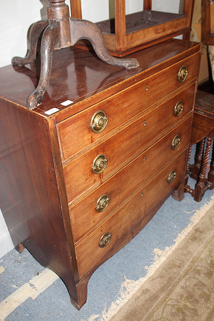 Appraisal: A GEORGIAN MAHOGANY CHEST of four long drawers standing on