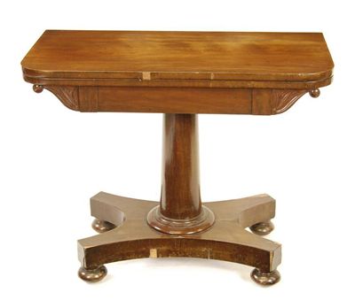 Appraisal: A Victorian mahogany card table on a turned stem and