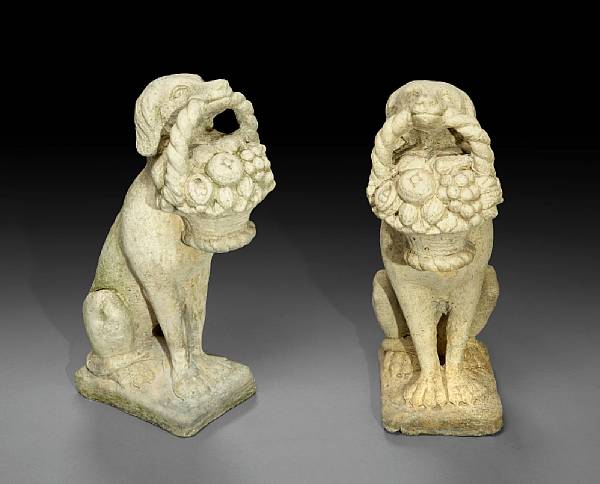 Appraisal: A pair of cast stone figures of seated hounds Each