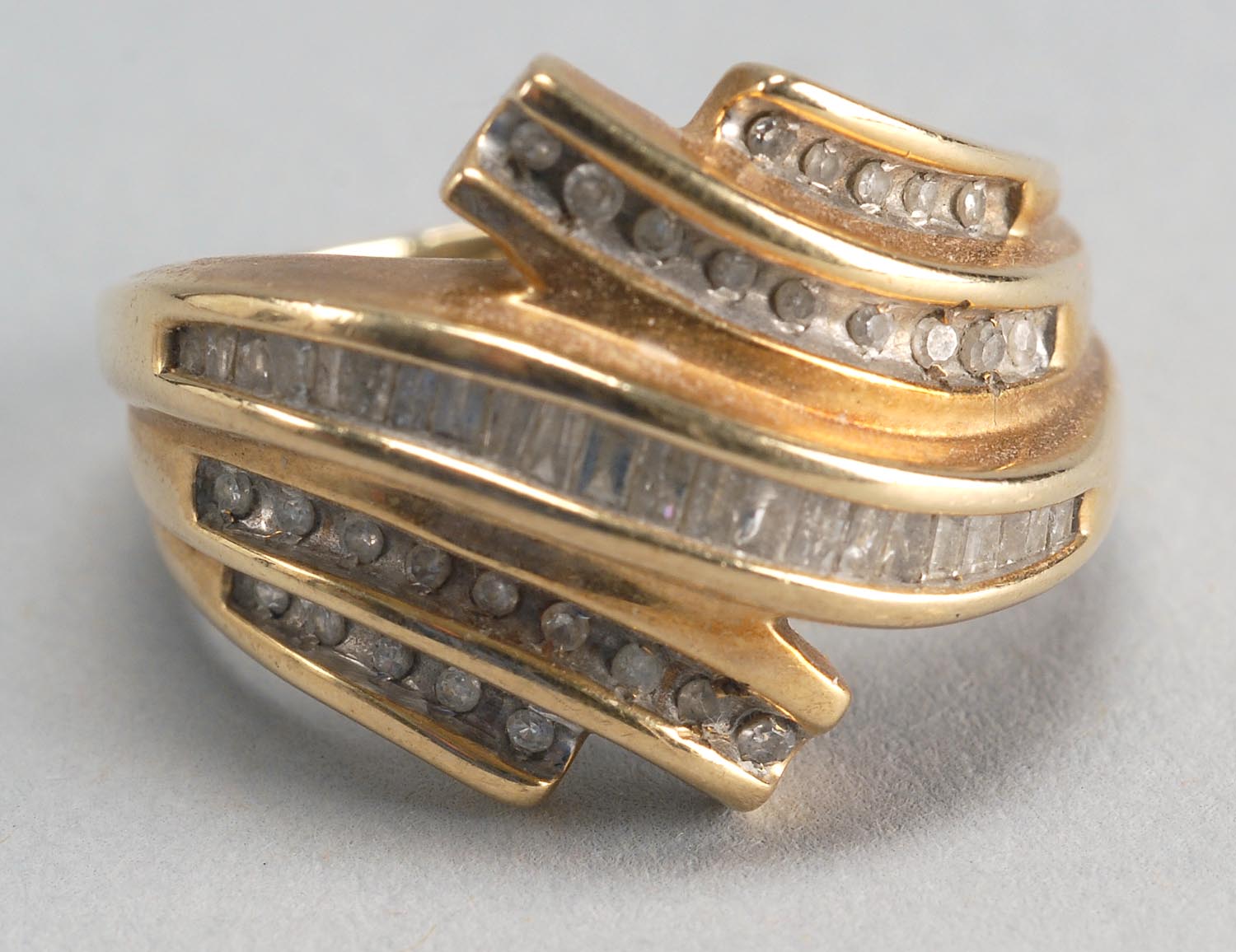 Appraisal: KT YELLOW GOLD AND DIAMOND COCKTAIL RING With five bands