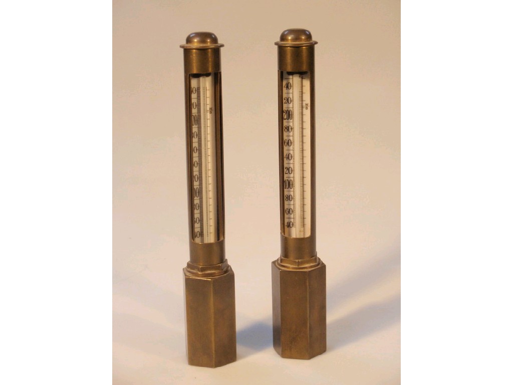 Appraisal: A pair of brass cased thermometers each enclosed in a