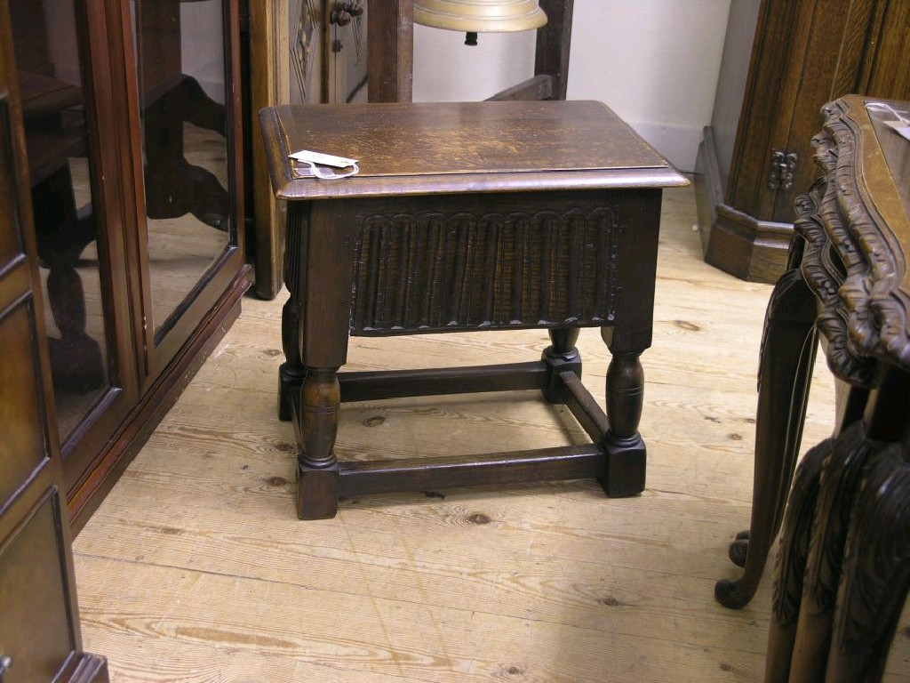 Appraisal: A dark oak joint stool with hinged top ft in