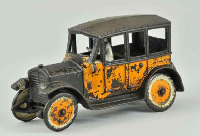 Appraisal: KENTON YELLOW CAB Kenton cast iron painted in orange black