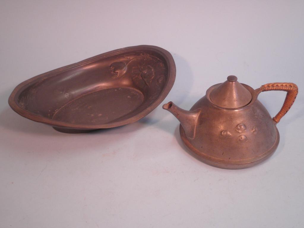 Appraisal: A Liberty pewter kettle with a wicker handle stamped Tudric