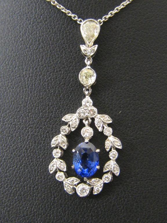 Appraisal: A Sapphire and Diamond Necklace the oval shaped sapphire approx