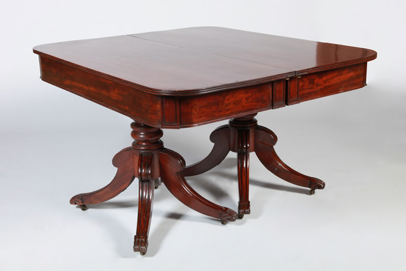 Appraisal: VICTORIAN MAHOGANY TWO-PEDESTAL EXTENSION DINING TABLE Fitted with two leaves