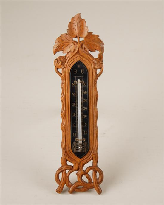 Appraisal: A Folk Art Carved Thermometer of walnut carved in a