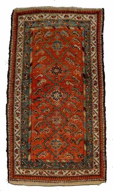 Appraisal: A PERSIAN MAHAL RUST GROUND RUG multiple diamond motif within