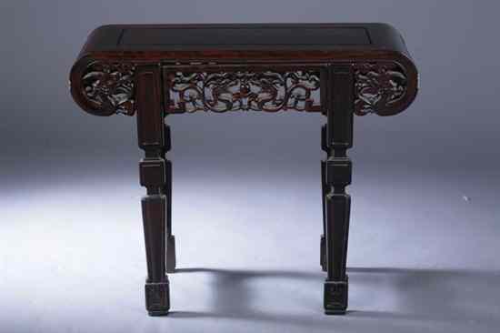 Appraisal: CHINESE ROSEWOOD ALTER TABLE The scroll-form top above a dragon