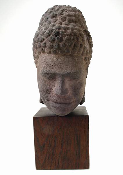 Appraisal: A Thai red sandstone Buddhist head fragment mounted on a