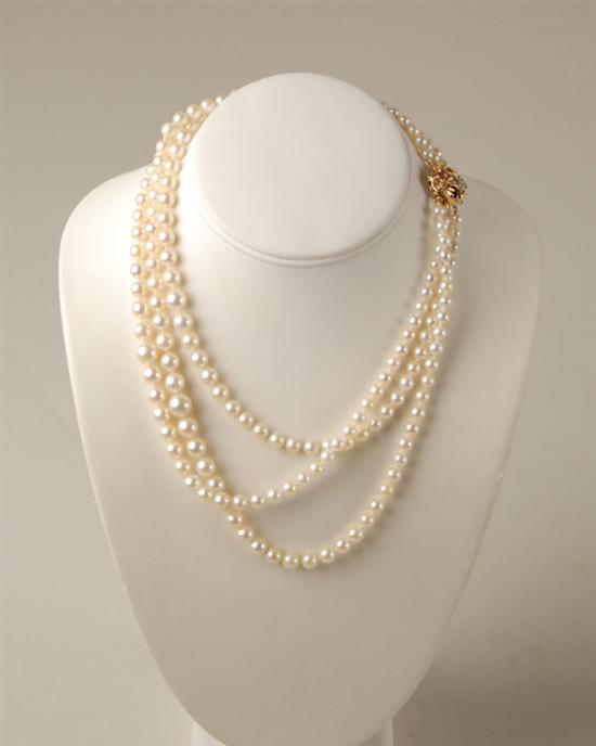 Appraisal: A Triple Strand Graduated Pearl Necklace having a K marked