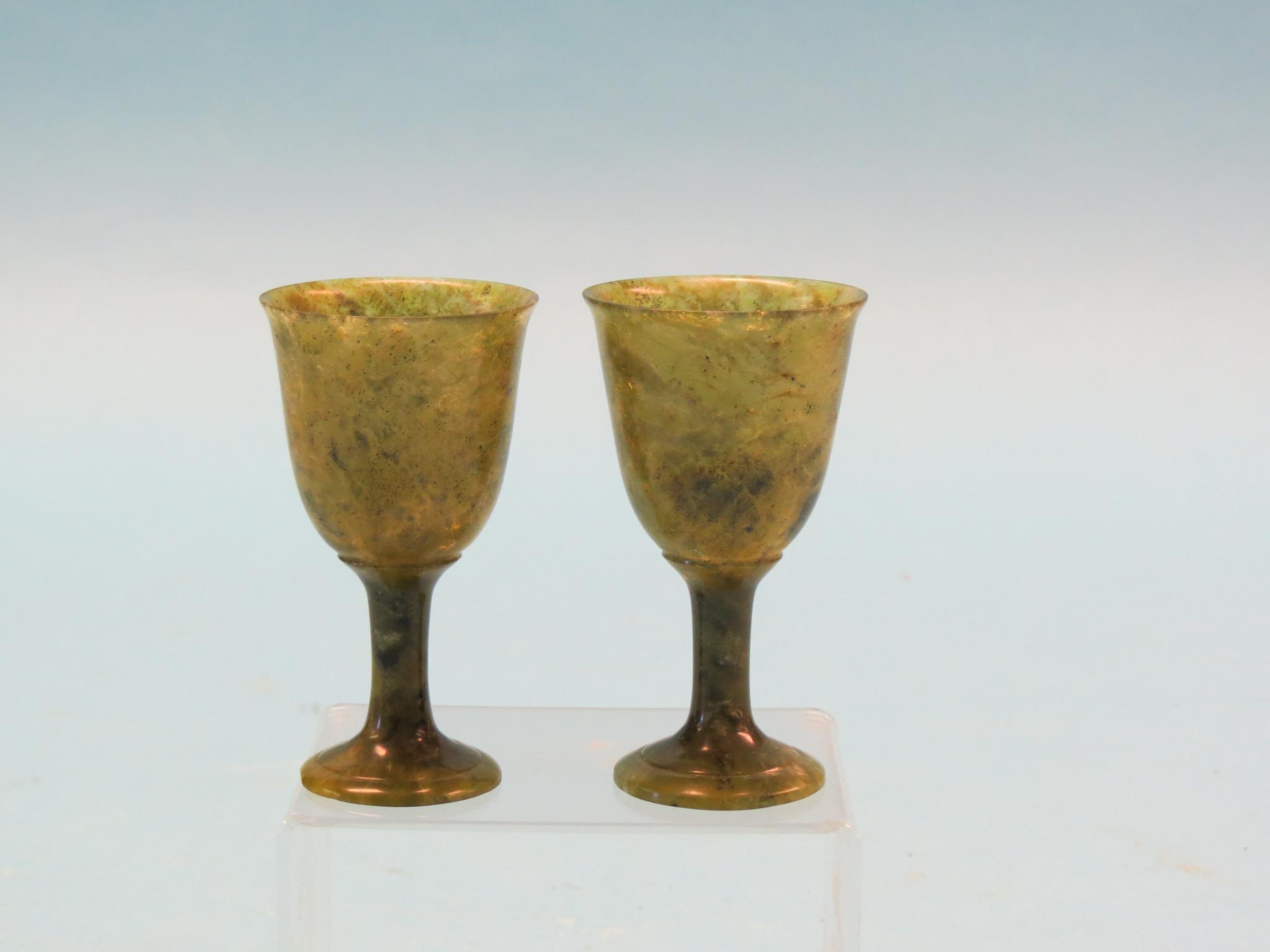 Appraisal: A pair of carved spinach jade miniature goblets in