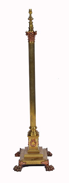 Appraisal: A TH CENTURY BRASS STANDARD LAMP with a fluted column