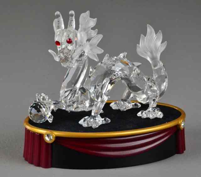 Appraisal: Swarovski Crystal Dragon with StandBeautiful crystal dragon with red eyes