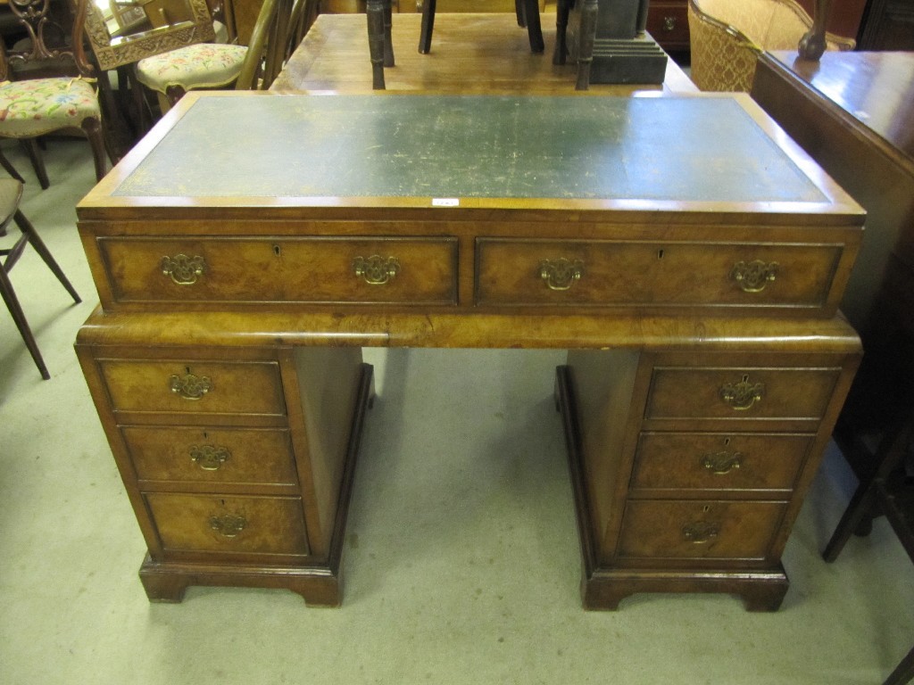 Appraisal: Walnut kneehole desk with leather top