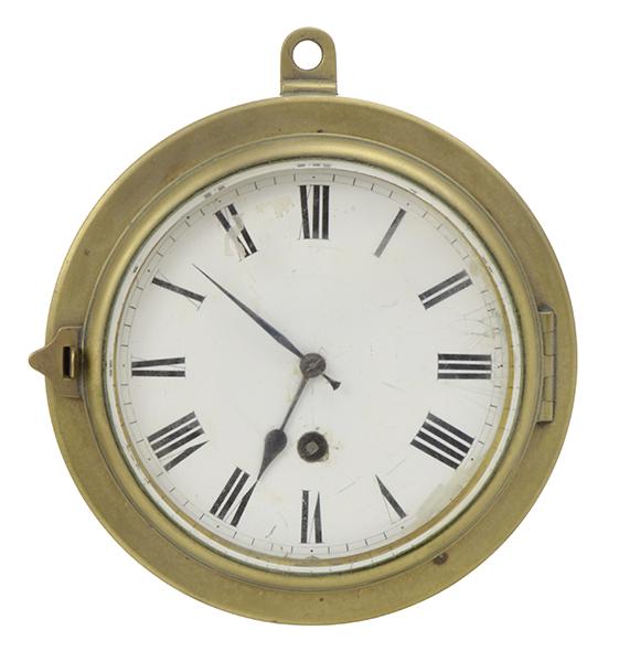 Appraisal: A BRASS CASED SHIPS CLOCK with an enamelled Roman numeral