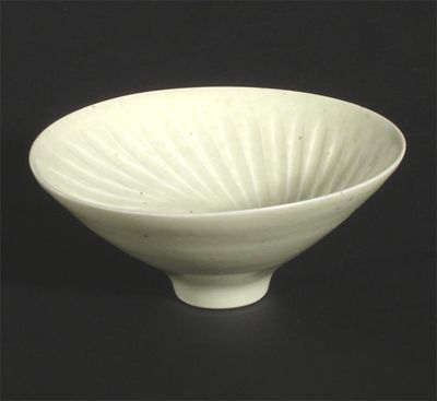 Appraisal: A small Marianne de Trey porcelain bowl with fluted interior