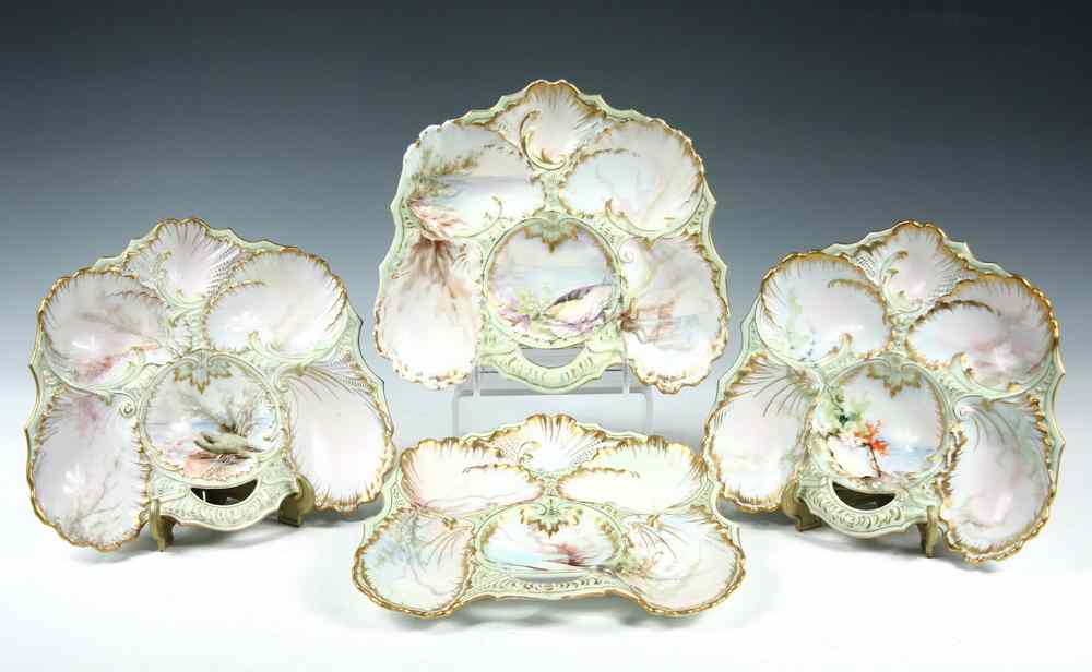 Appraisal: FRENCH HANDPAINTED OYSTER PLATES - Dimensional gilt decorated with pale