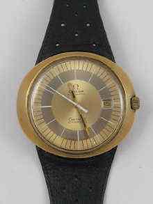 Appraisal: A gold plated and steel Omega Geneve dynamic automatic date