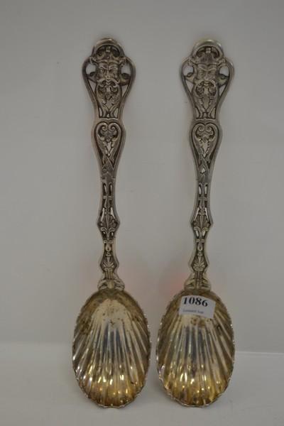 Appraisal: TWO VICTORIAN STERLING SILVER SERVING SPOONS ZEUS HEAD TO HANDLE