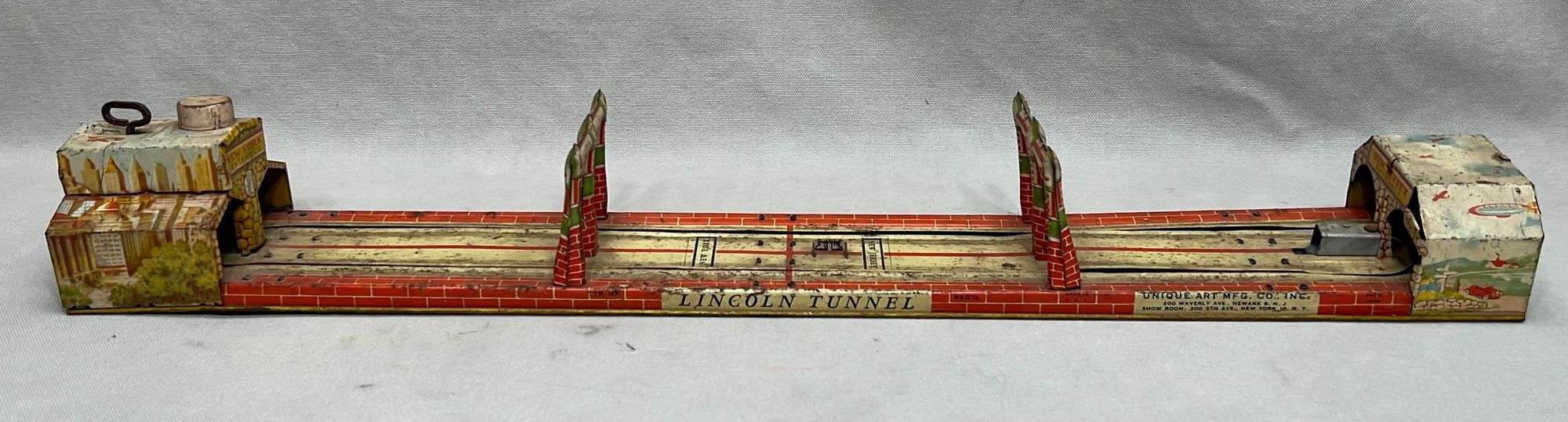 Appraisal: Unique Art Lincoln Tunnel tin litho toy platform