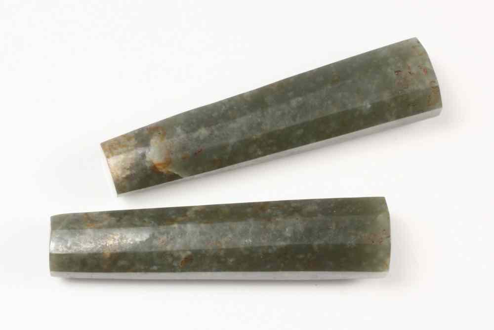 Appraisal: PAIR EARLY CHINESE JADES- mottled green stone cut into tapering