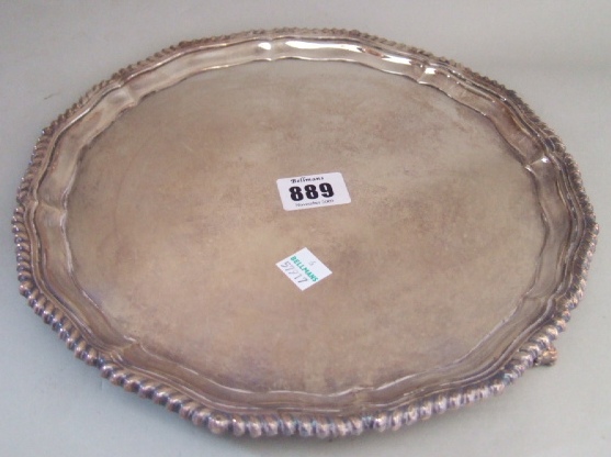 Appraisal: A silver salver of shaped circular form decorated with a