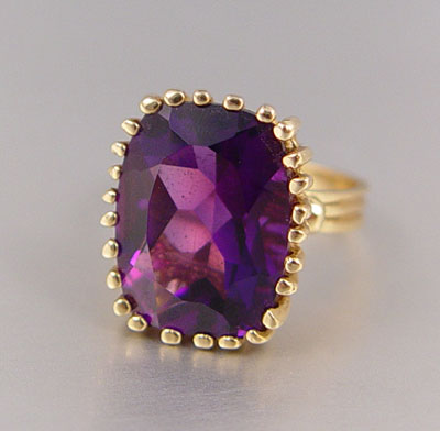 Appraisal: CT CUSHION CUT AMETHYST RING K yellow gold ring contains