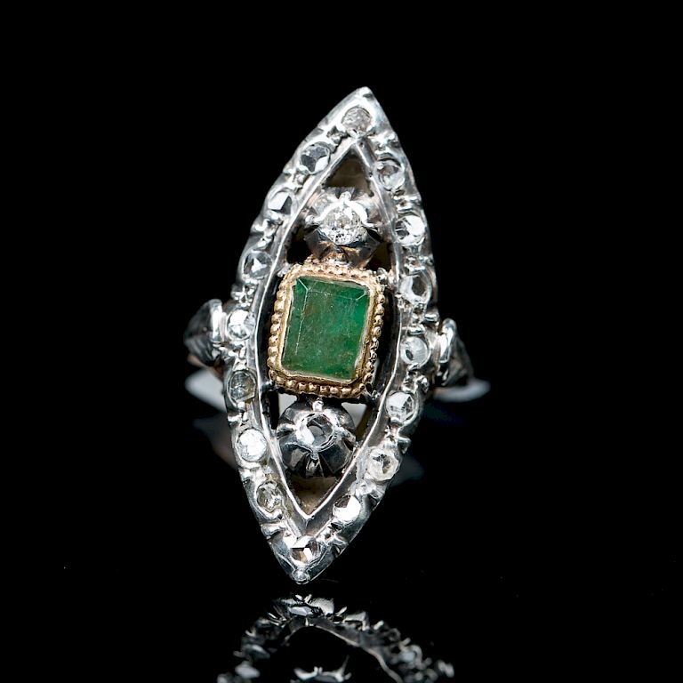 Appraisal: EMERALD AND GOLD RING Of an almond shape design with