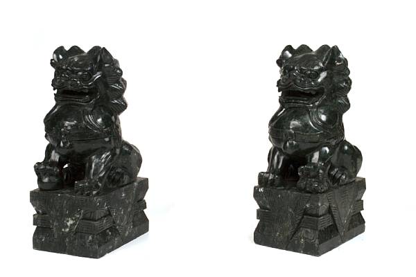 Appraisal: A pair of hardstone Fu dogs height in width in