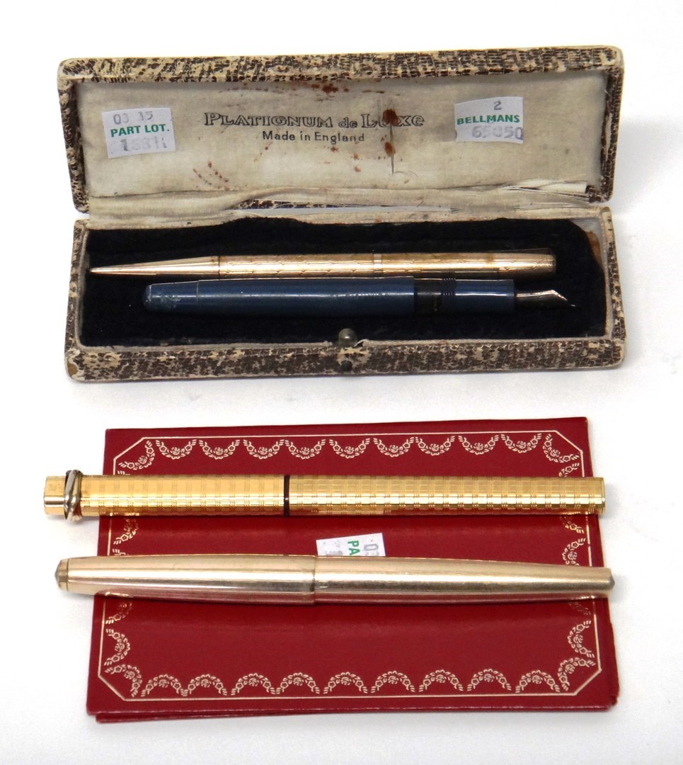 Appraisal: A gilt metal cased Cartier Paris fountain pen with engine