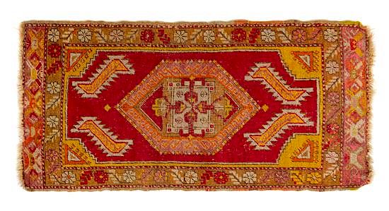 Appraisal: Two Turkish Wool Rugs Larger example feet inches smaller example