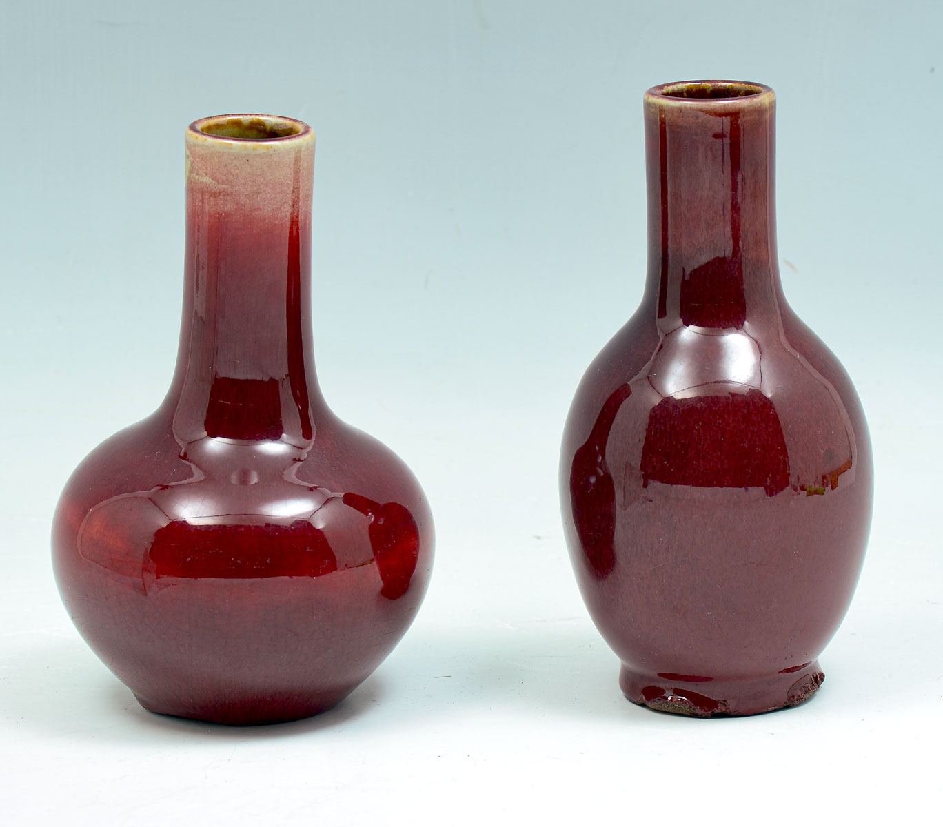 Appraisal: CHINESE FLAMBE PORCELAIN BOTTLE VASES - Sang de Boeuf glazed