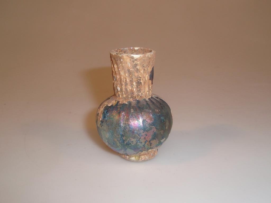 Appraisal: A post-Roman bluish-green footed glass jar the funnel neck and