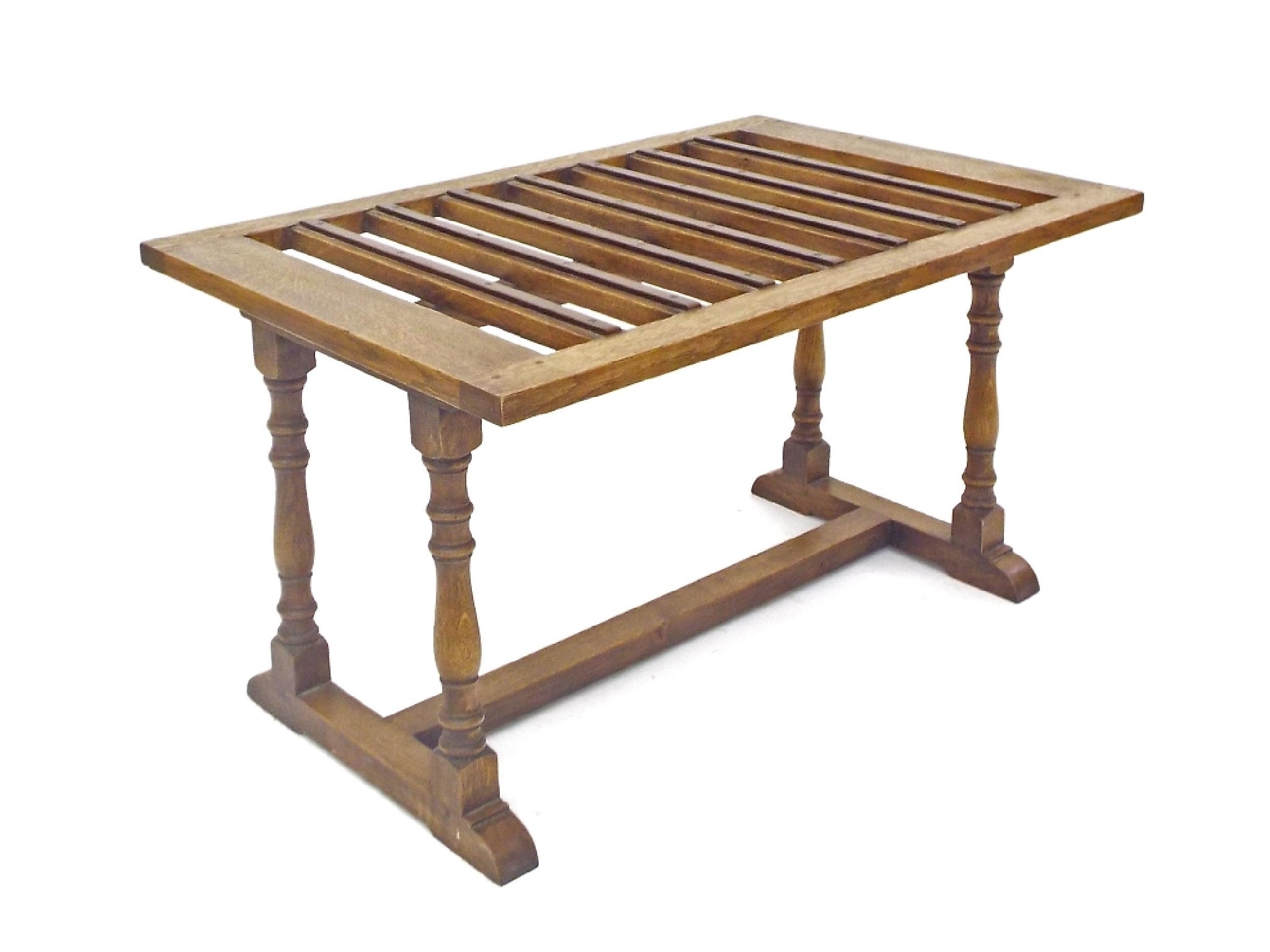 Appraisal: Oak luggage rack with applied copper stretchers upon four baluster