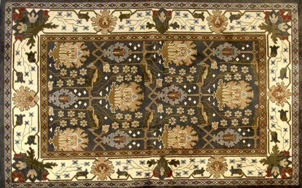 Appraisal: WILLIAM MORRIS STYLE Area rug with a geometric floral pattern