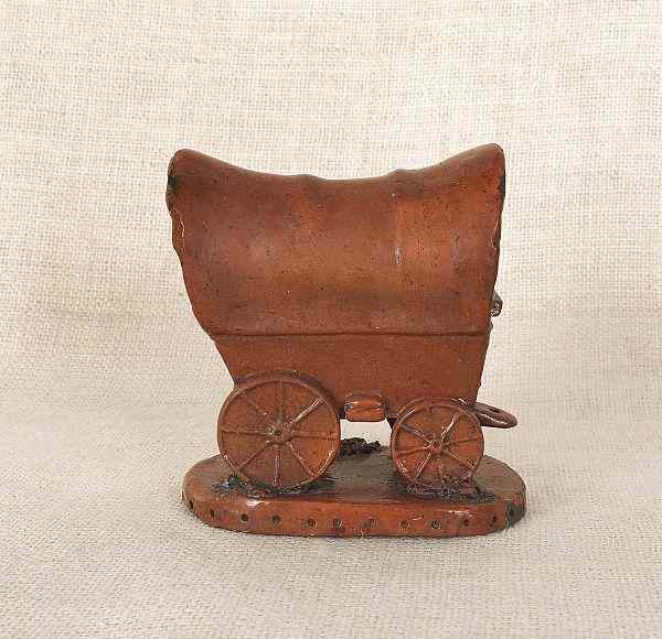 Appraisal: Pennsylvania redware Conestoga wagon form bank th c h Provenance