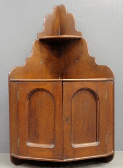 Appraisal: - Walnut hanging corner cupboard late th c with two