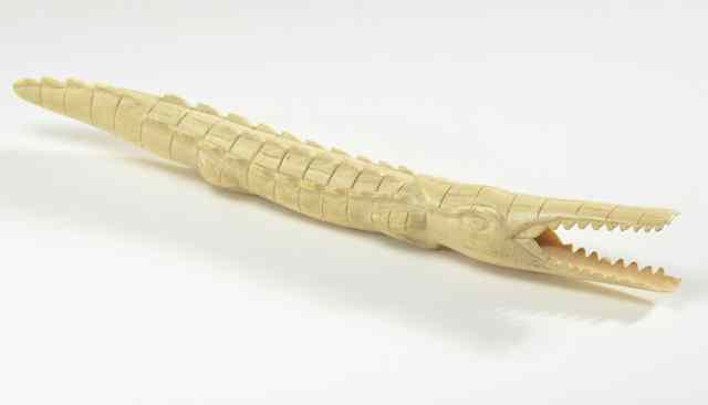 Appraisal: AN AFRICAN HAND CARVED IVORY CROCODILE with open mouth Length