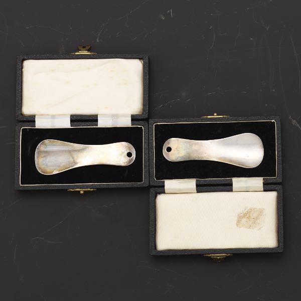 Appraisal: TWO ENGLISH SHOEHORNS Two sterling silver shoehorns with original boxes