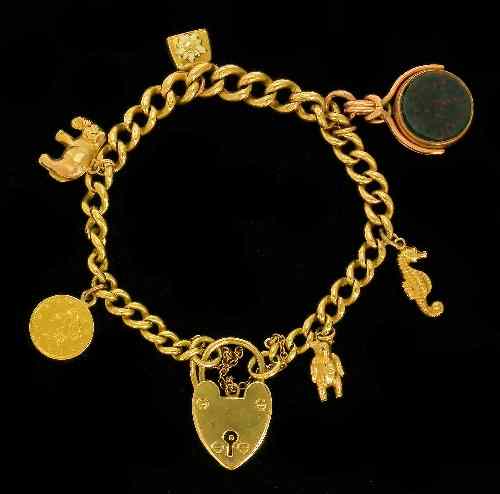 Appraisal: A modern ct gold link bracelet hung with six charms